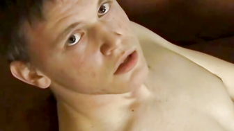 Long haired twink Logan Miles masturbates his thick cock