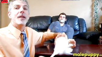 Professor Richard Lennox tickles the feet of his young student Kody Tracer