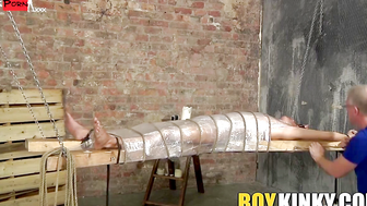 Bound young twink enjoys handjob from mature master