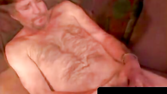 Handsome silver fox milks his cock and spurts cum