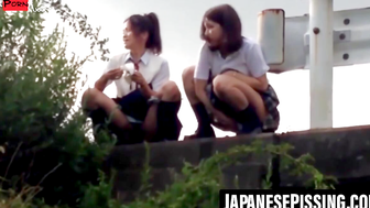 Voyeurs cam catches two Asian ladies firing long piss streams