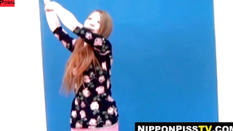 Asian newbie girl wets her shorts during solo photo session