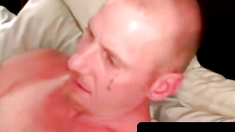 Tattooed hunk flexes muscles before jerking his meat