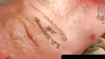 Tattooed hunk flexes muscles before jerking his meat