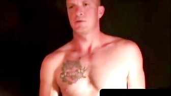 Tattooed Man Masturbates in Leather Chair