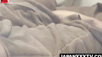 Hidden cam enjoys a view of a Japanese babe solo fingering