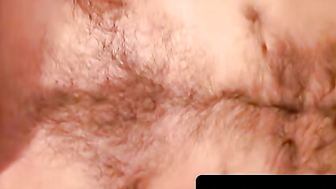 Hairy dude whips out his dick on the couch and cums