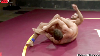 Muscle hunks wrestle for anal sex