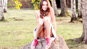 Petite Russian all natural girl exposing body while posing in the nature