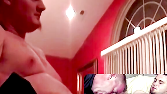 Naked Couple in Red Bedroom, One Man Receiving Oral Sex on Bed