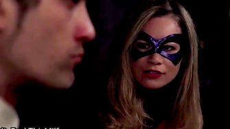 Masked Woman in Black Costume Gets Rough Treatment from Man