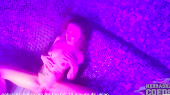 Elizabeth Fingers Her Shaved Pussy in a Purple Sauna