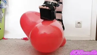 Popping red balloons with my african high heels sandals