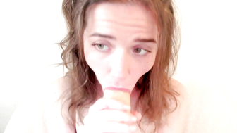 Brunette Amateur Girl Sucks Realistic Dildo in White Chair