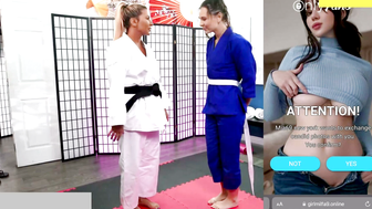 Blonde MILF in White Gi Dominates Brunette in Blue Gi on Red Mat