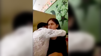 Desi Indian Couple Hugs and Kisses in Bedroom with Star Wall Decor