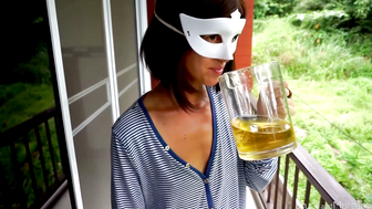 Masked Brunette Drinks Pitcher of piss on Balcony Outdoor Scene