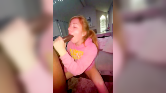 Blonde Girl in Pink Hoodie Deepthroats Black Cock on Bed