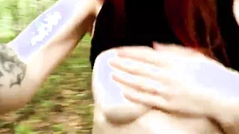 A sexual sluts with red hair and a tattoo is
