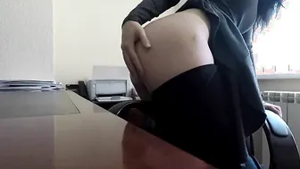 Inside the office a company employee caresses her cunt on