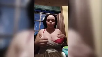 Big Boobed African pulls out big tits and shows how to