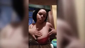 Big Boobed African pulls out big tits and shows how to