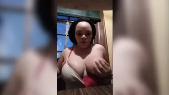 Big Boobed African pulls out big tits and shows how to