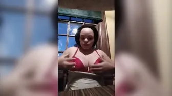 Big Boobed African pulls out big tits and shows how to