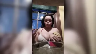 Big Boobed African pulls out big tits and shows how to