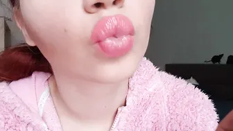 Glossy pink lips close up smoking