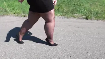 Old BBW inside nylon stockings and high heels walks down the outdoor