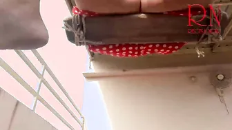 Depraved housewife swinging on a swing outside
