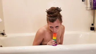 Dakota Riding her Rainbow Toy into the Shower