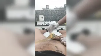 Young women waxes penis