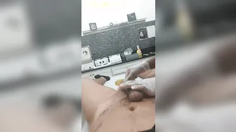 Young women waxes penis