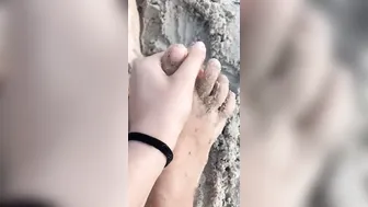 Doing Toes Peeling at the Beach.