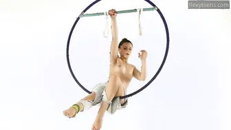 Dark Hair Kim Nadara into yellow socks doing acrobatics