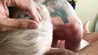 Bombshell GILF sucking off big black dick