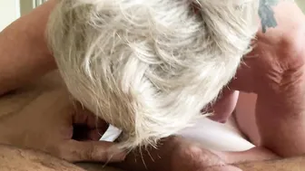 Bombshell GILF sucking off big black dick