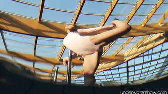 Roxalana Cheh wearing pink dress inside the pool