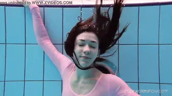 Roxalana Cheh wearing pink dress inside the pool
