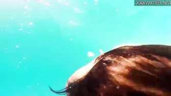 Amelie Bruna delicious dark haired with gigantic boobies into the pool