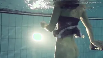 Blue clothed Duna Bultihalo with huge breasts inside the pool