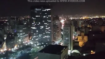 Woman getting jugs out inside the Martinelle building inside downtown São Paulo