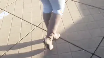 Walking into mediamark with high heel shoes louboutin and blue