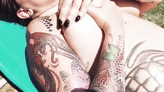 Bombshell Tattooed sluts Having Fun with her Huge Boobies next to the Pool