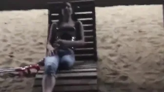 amputee woman crutching into beach