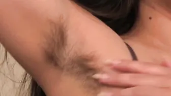 Irresistible bushy dark hair masturbates on grey bed