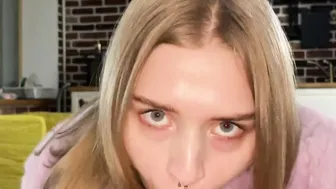 A Bitch into a Pink Fur Coat Eagerly Blows a Penis