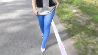 Flashing on the street into blue tights